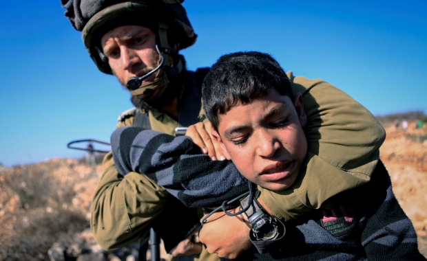 Israeli Soldier Attacking Palestinian child